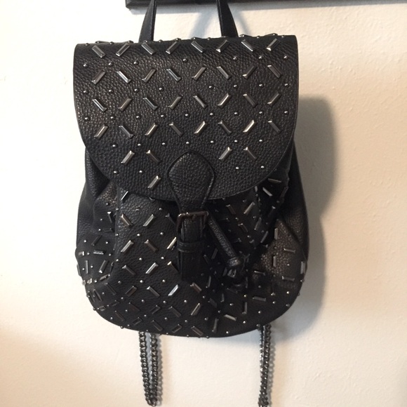 Charming Charlie Handbags - Charming Charlie’s black and silver mini backpack